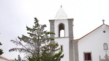 Church bell tower and entrance in Portugal