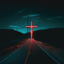 Cross on the road at night. Neon lights