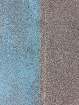 Color contrast blue and grey pavement texture