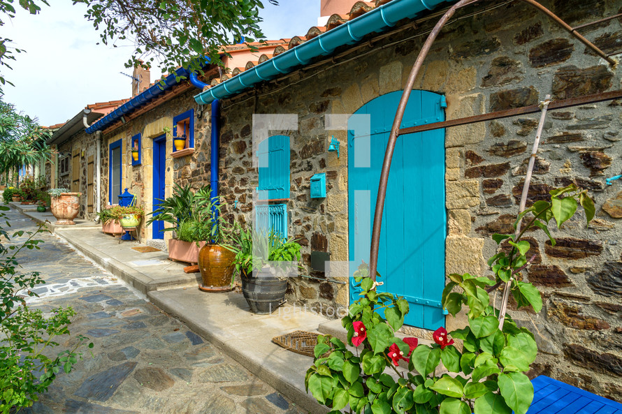 colorful doors on stone houses in a village in France 