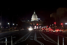 streets at night leading to the US Capital building 