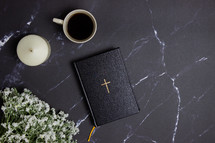 Bible on a black marble background 