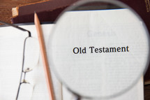 magnifying glass over Old Testament 