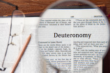 magnifying glass over Deuteronomy 
