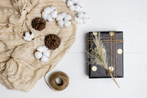 cotton, pine cones, and gift 