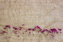 purple flowers on linen 