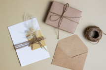 envelope with flowers and twine and gift 