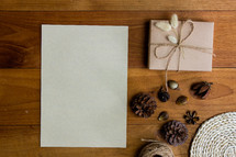 wrapped brown paper gift box and pine cones 