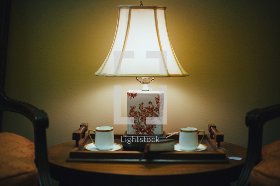 lamp and coffee cups and Bible 