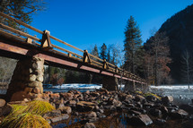 Bridge crossing water with snowy banks