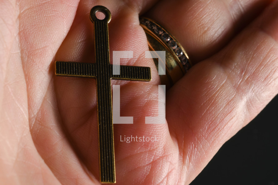 cross in the palm of a hand 