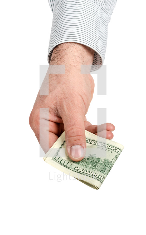 Hand holding folded hundred dollar bills.