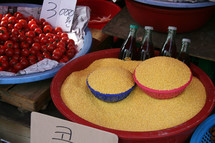 grains and fruit in bowls in a market 