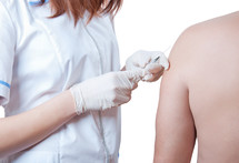 Nurse administering a vaccination.