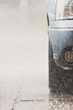 downpour of rain bounces off a vehicle