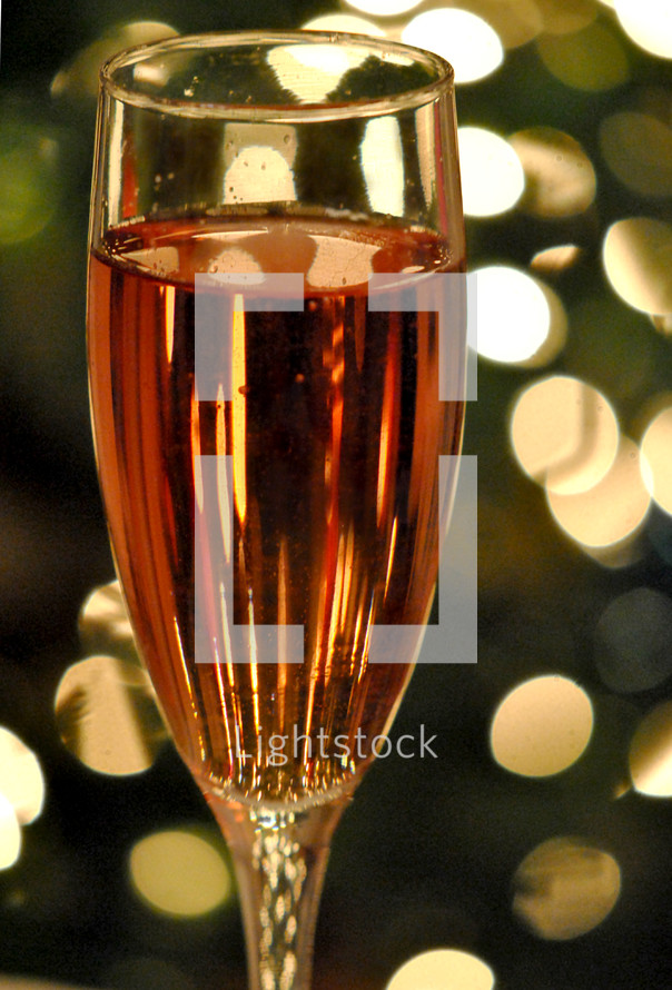 A glass of wine with bokeh background
