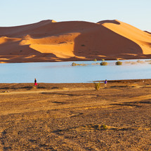 sand dunes and water in a lake in Morocco 