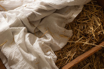 empty manger in hay 