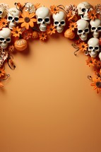 Skulls with flowers on orange background. Halloween holiday concept.