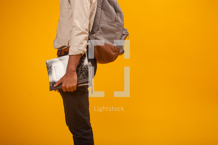 a student holding books 