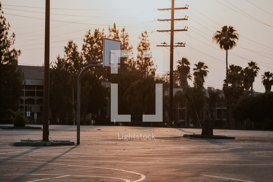 outdoor basketball court at sunset 