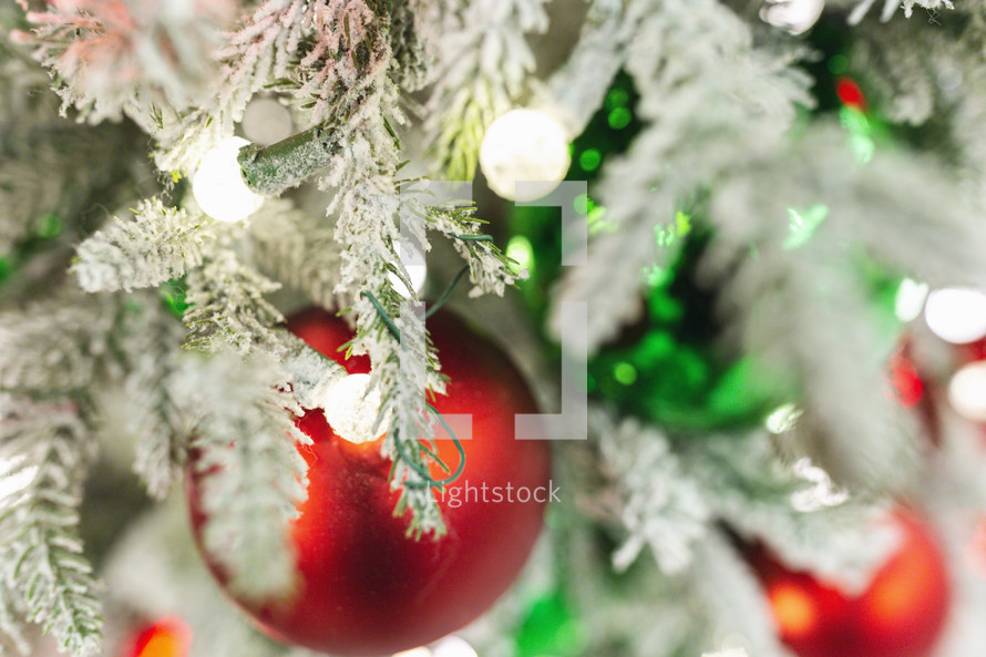 bokeh lights and red and green Christmas ball ornaments 