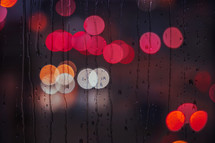 raindrops on the window and street lights bacground at night