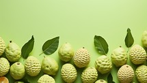 Fresh ripe bergamot fruits with green leaves on green background