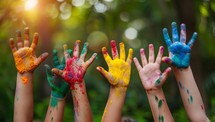 Hands of child covered with colorful paint on holi festival.