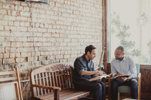 men reading a Bibles at a Bible study 
