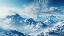 Snowy mountains and clouds. Panoramic view.