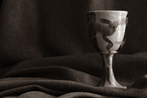 clay chalice on brown linen 