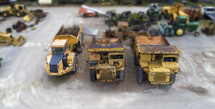rusty construction trucks, toy cars 