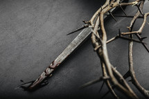 Crown of thorns and a blood covered nail.