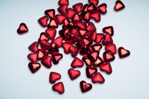 tiny red Valentines hearts on white 