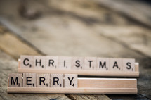 word Merry Christmas in scrabble pieces 