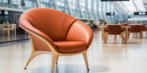 Modern orange armchair in the lobby of a modern office building