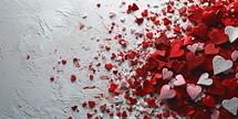 Red and white hearts confetti on white background. Valentines day background