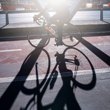 bike shadows on the bicycle track on the street, mode of transportation