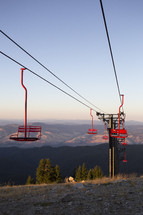 a ski lift going up a mountain without snow 