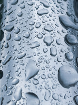  raindrops on the metallic surface in rainy days