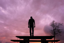 man silhouette in the mountain and sunset background