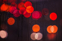 raindrops on the window and street lights bacground at night