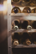 wine bottles on a rack