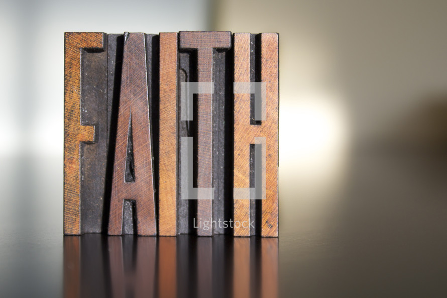 word faith in wood blocks