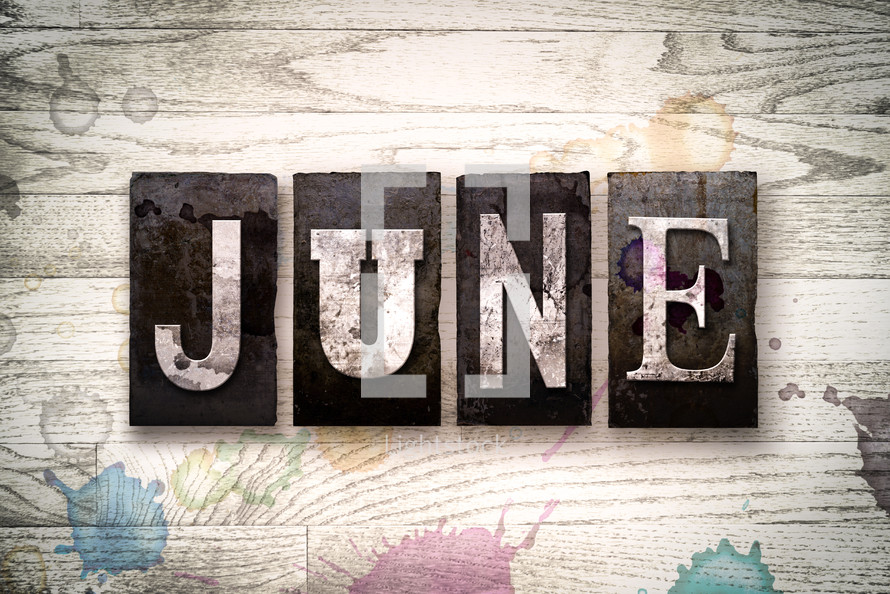 word June on wood background 