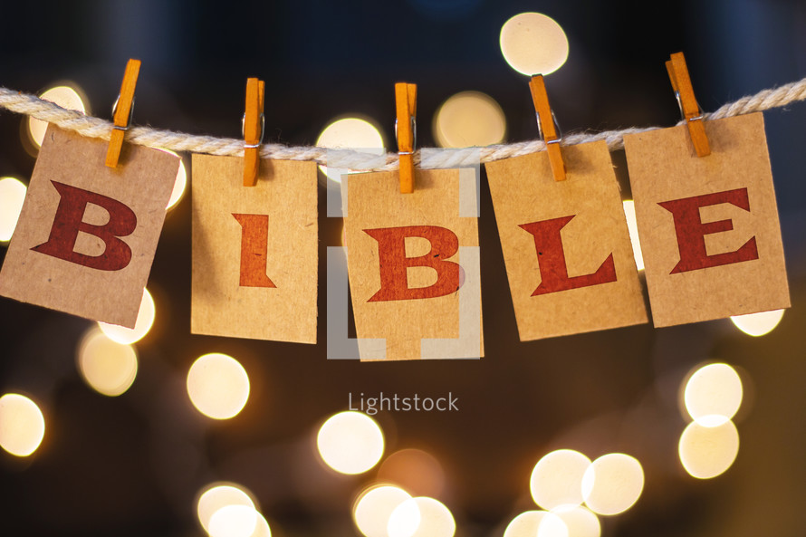 word Bible hanging on clothes pins 