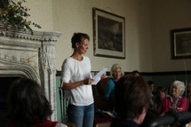woman speaking in front of a group 