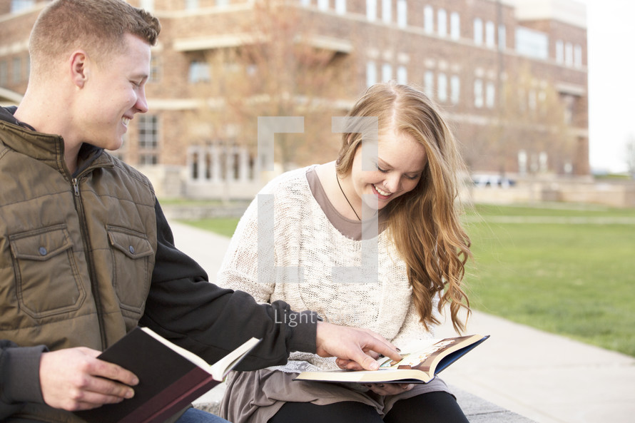 students reading on campus 