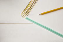 a pencil and notepad 